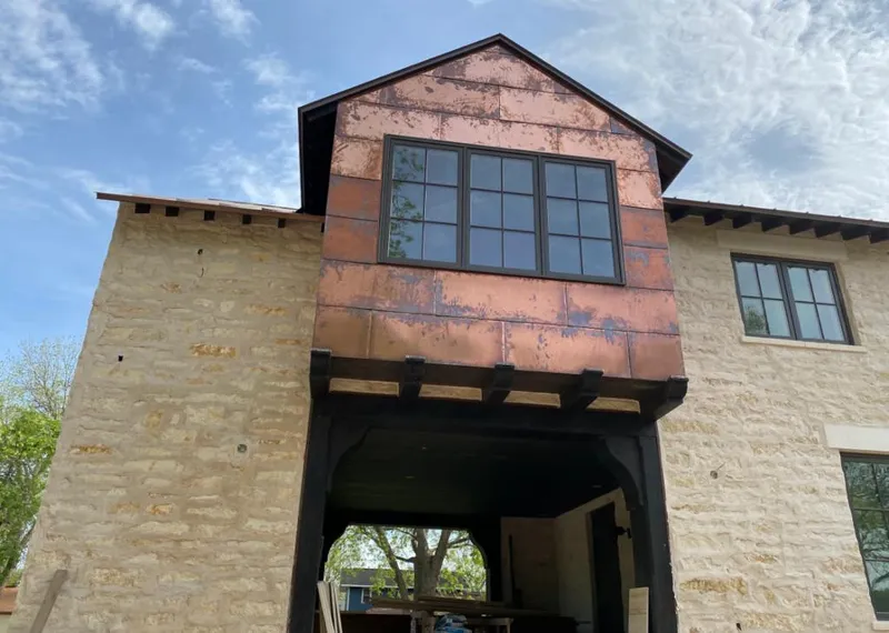 Copper metal panel facade on a stone building for Metal Roof Coating in Los Ranchos de Albuquerque