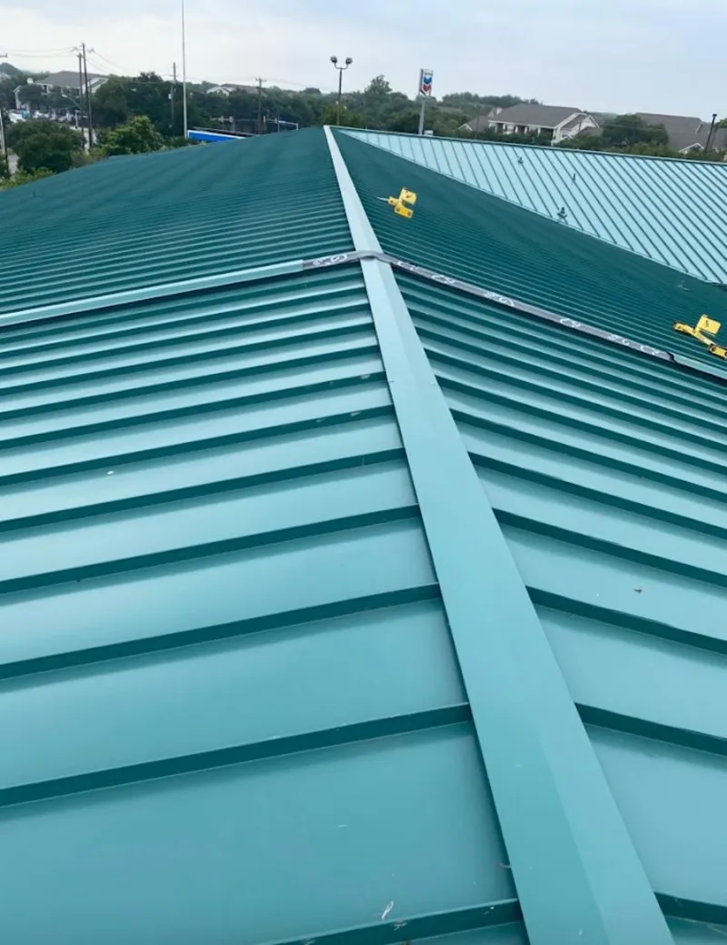 Green commercial metal roof ridge and valley for Metal Roof Repair in Los Ranchos de Albuquerque